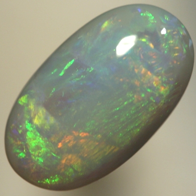 SOLID SEMI BLACK OPAL Orange and green move bright in rolling flashes